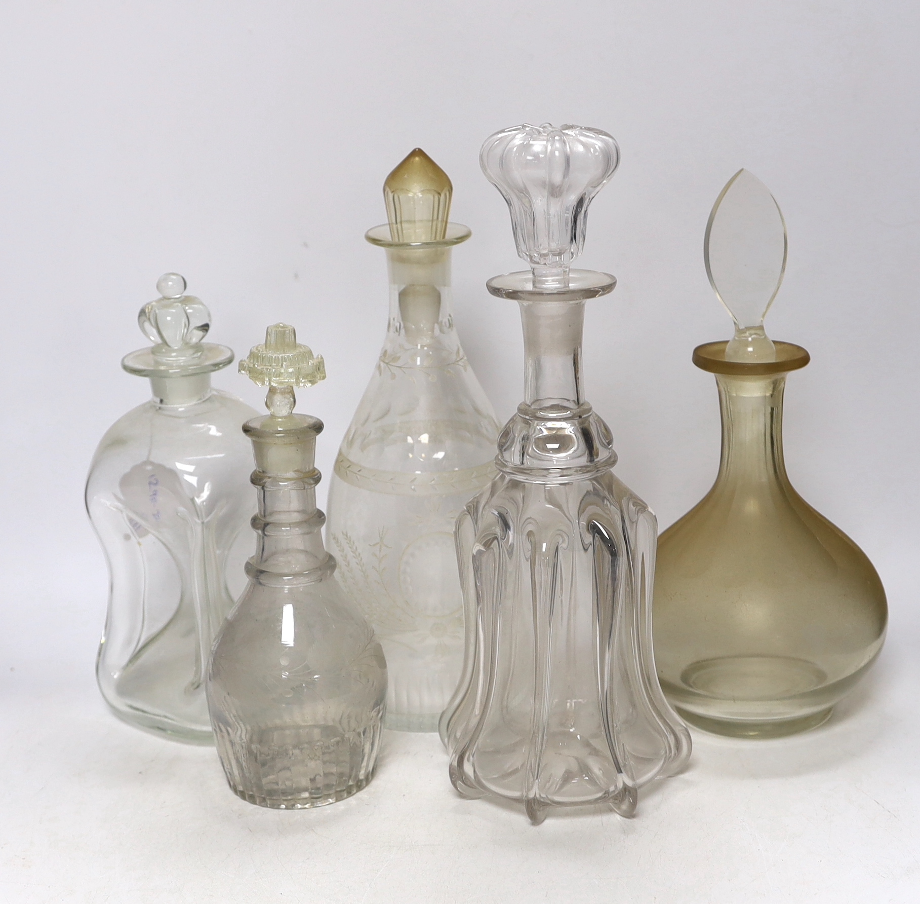 Five 19th century and later glass decanters, one with stopper in the form of a crown, tallest, 32.5cm